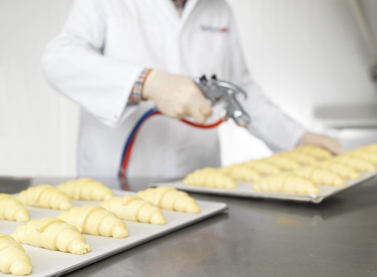 Spraying croissants